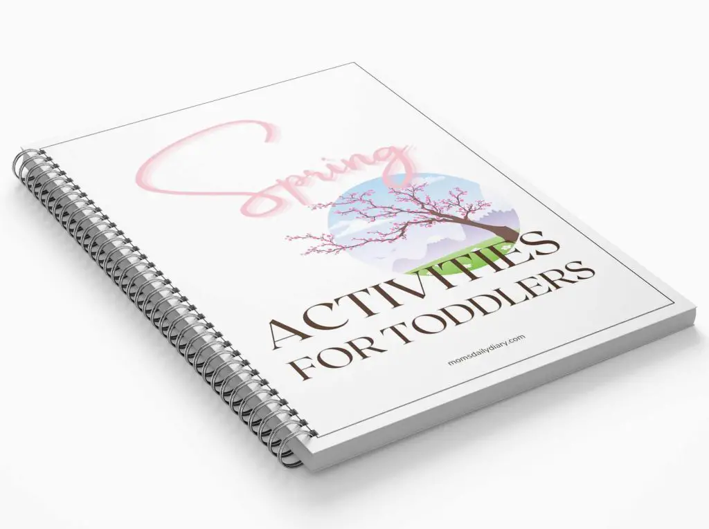 Promotional image of a spiral notepad with text Spring activities for toddlers and an illustration of a blooming tree in the spring.