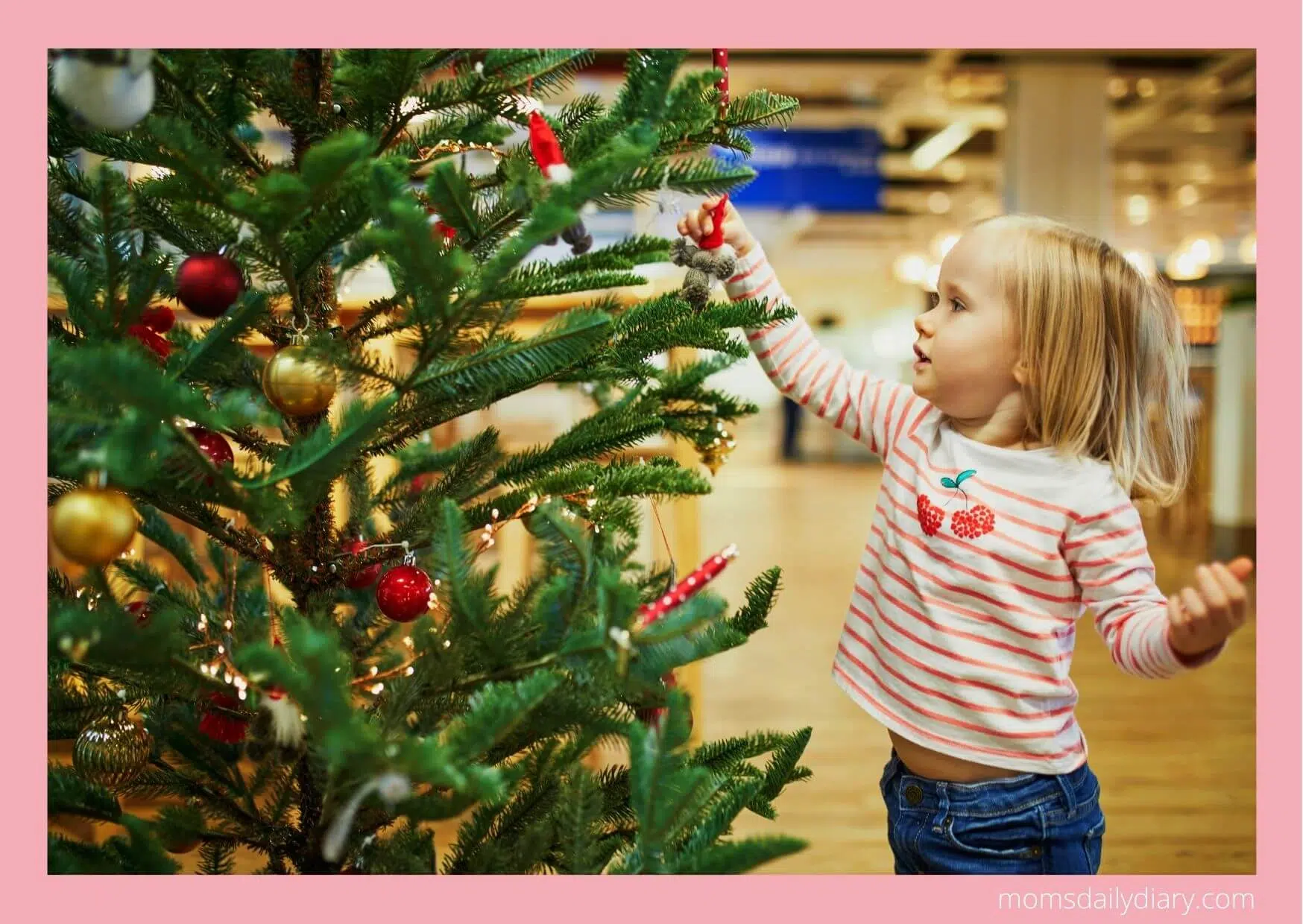 Christmas activities: Toddler ornamenting a tree
