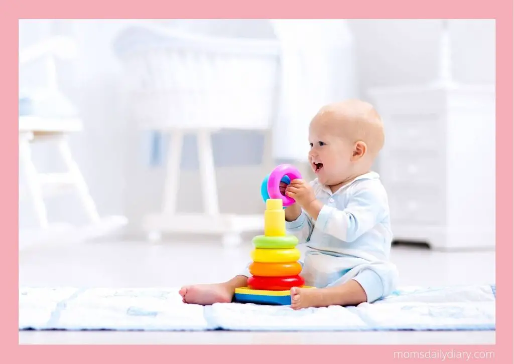 10 months old baby playing with stacking toys